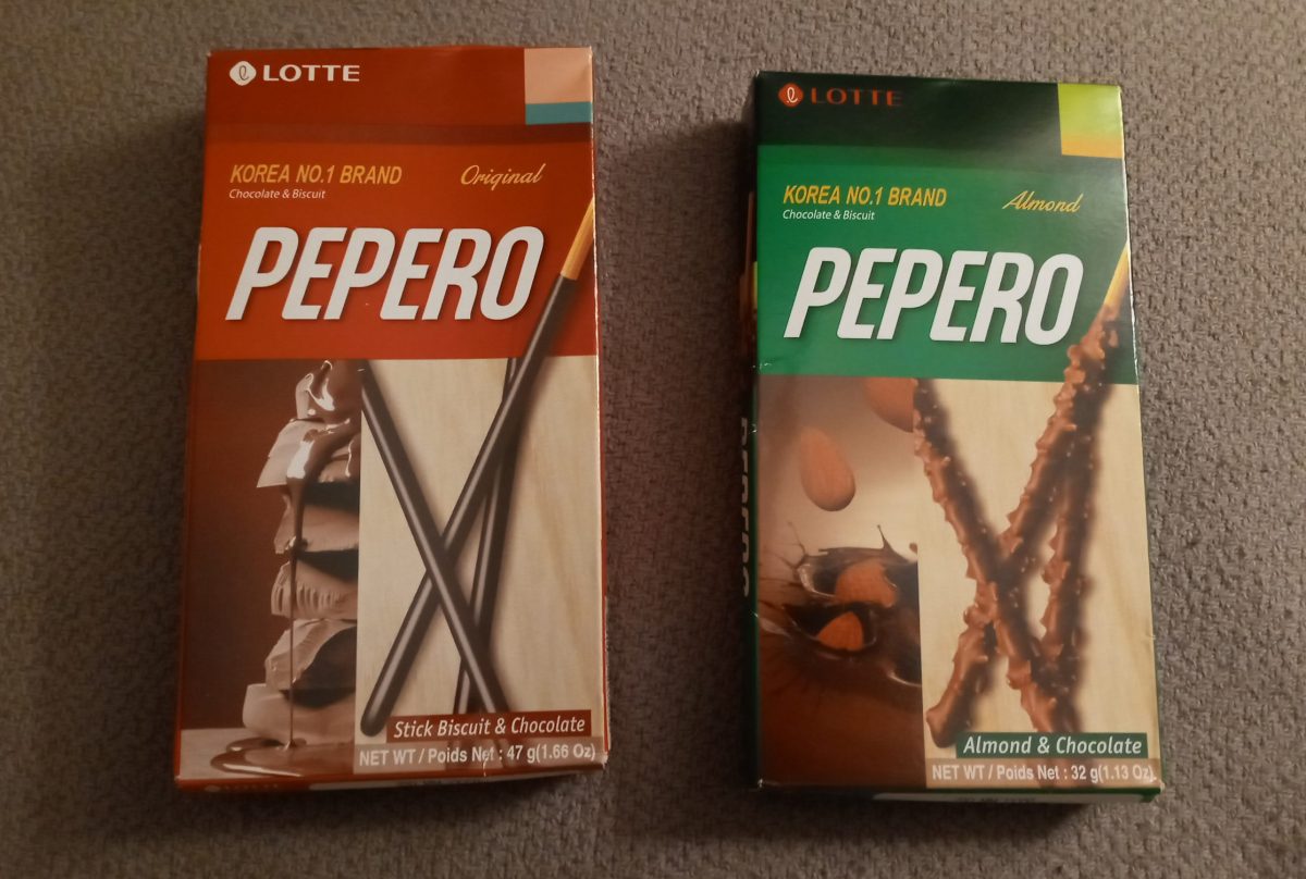 Photo of original and almond flavors of PEPERO brand chocolate and biscuit treat boxes