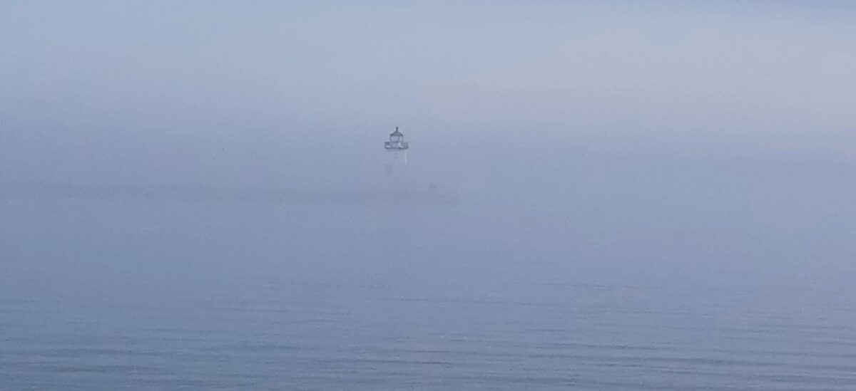 photo of lighthouse in fog, Grand Marais, Minnesota