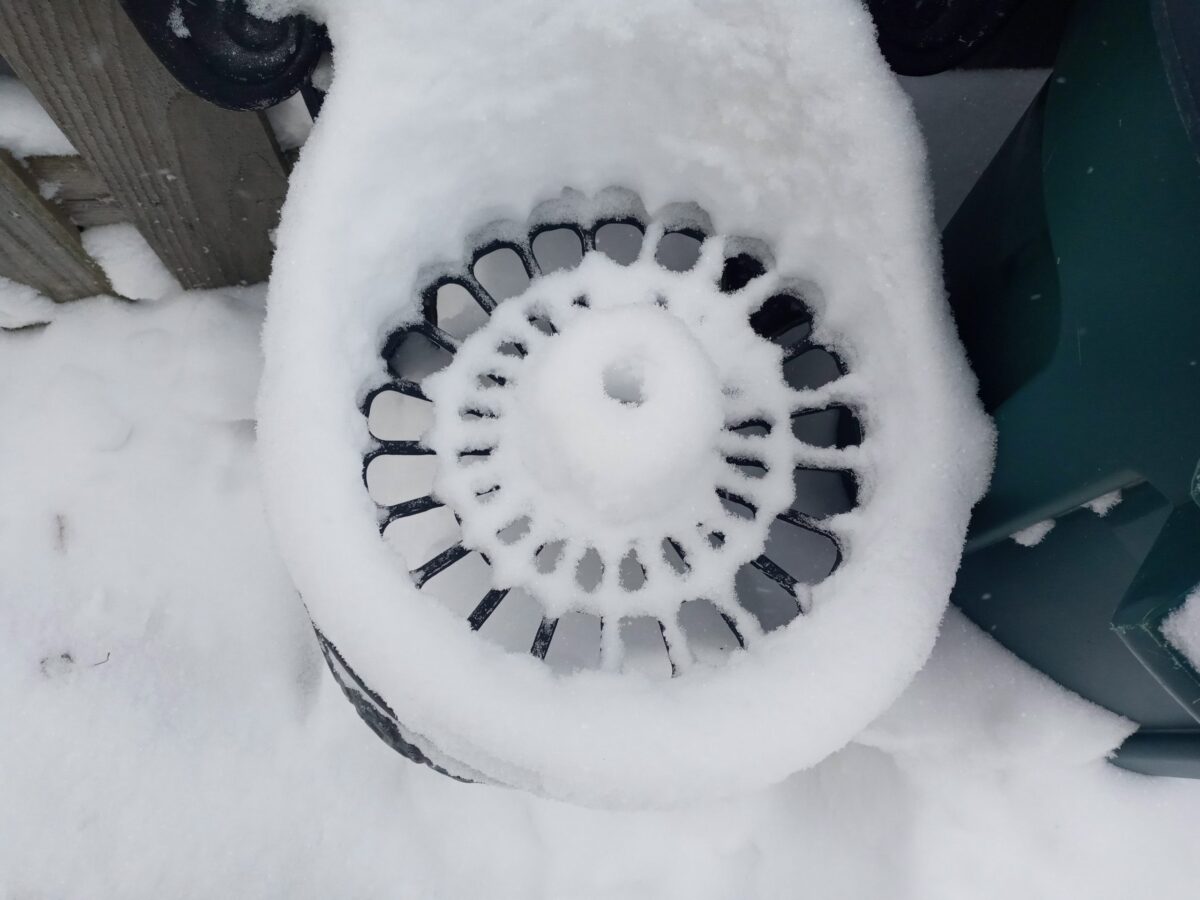 photo of chair covered in snow